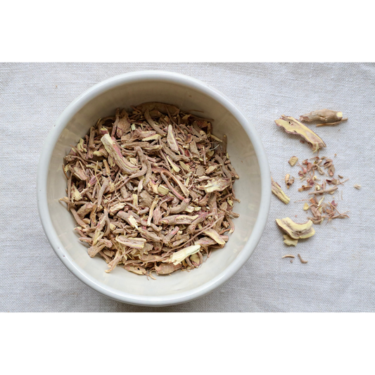 Organic Ashwagandha Root on display in bowl and on cloth