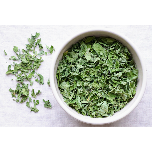 Vibrant Organic spearmint in bowl and on cloth for display